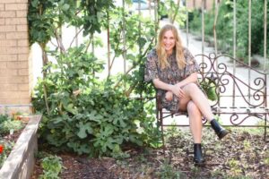 Amanda Rodriguez, a play therapist sitting on a bench at Keller Child and Family Therapy